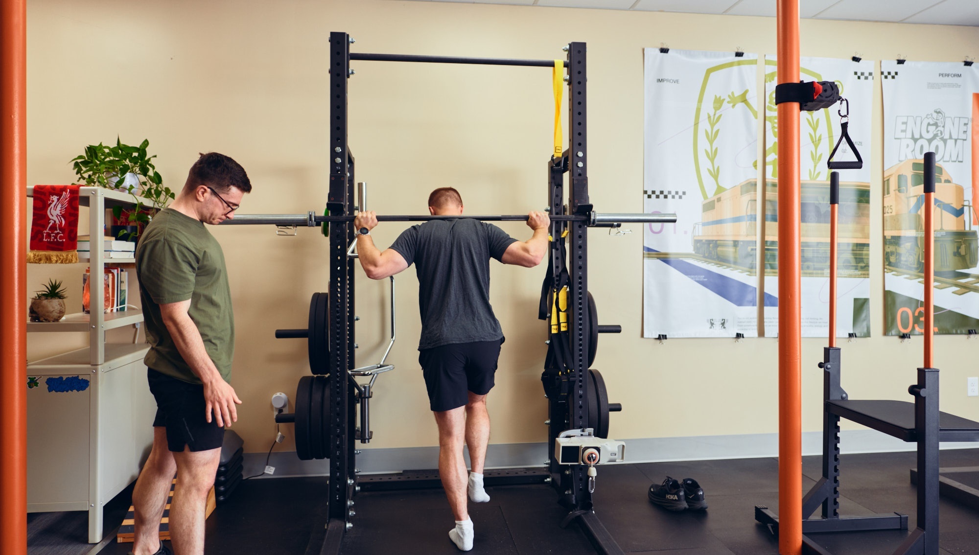 athlete performing return-to-sport testing on a force plate with a physical therapist observing